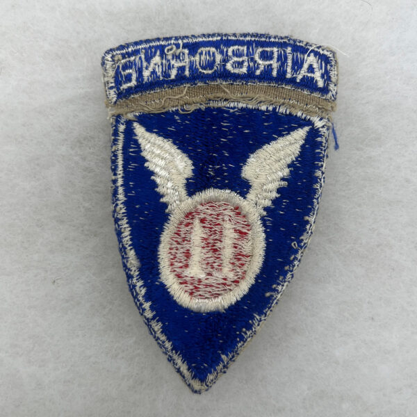WW2 US Army 11th Airborne Division Patch Attached Tab Worn - Image 2